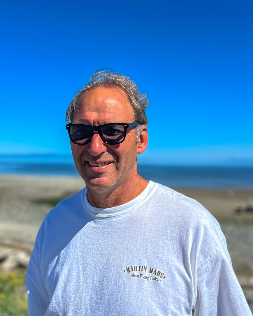 Steve Galpin taking a walk on the beach